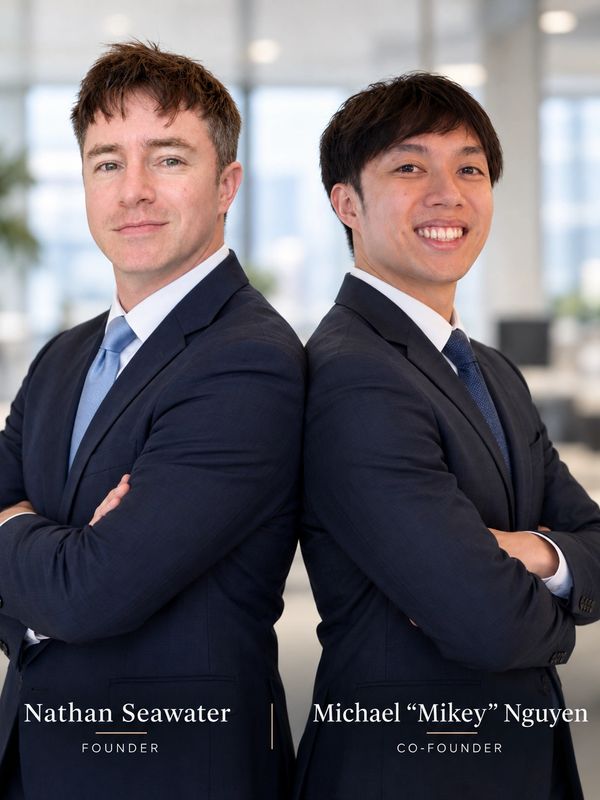 Two business founders standing back to back confidently.