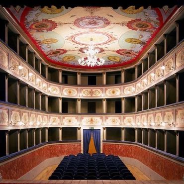 Grand ornate opera house interior.