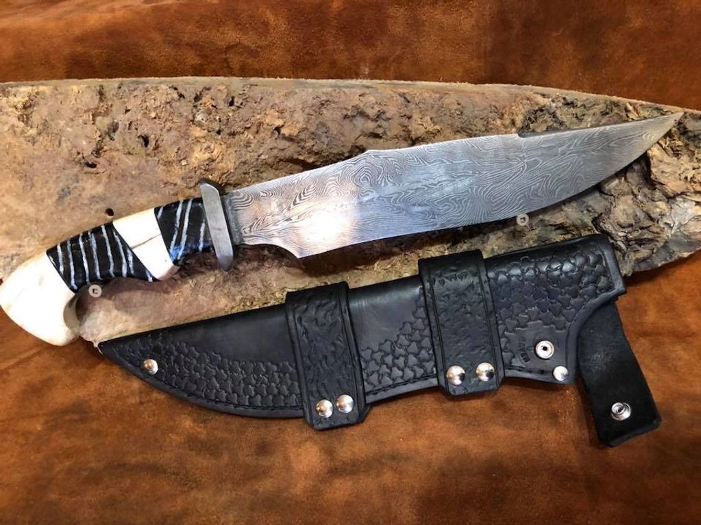 Narwhal and Mammoth tooth bolster with random Damascus. This is my first Bowie.