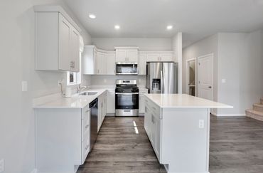 Modern kitchen with open floor plan, real estate photo