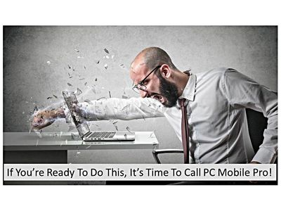 Guy punching laptop screen in frustration