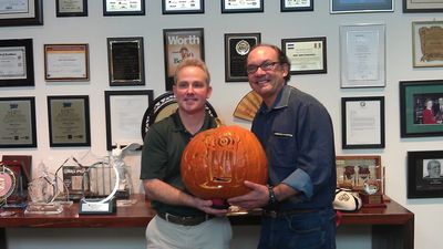 Tom carving for Mercy Corps