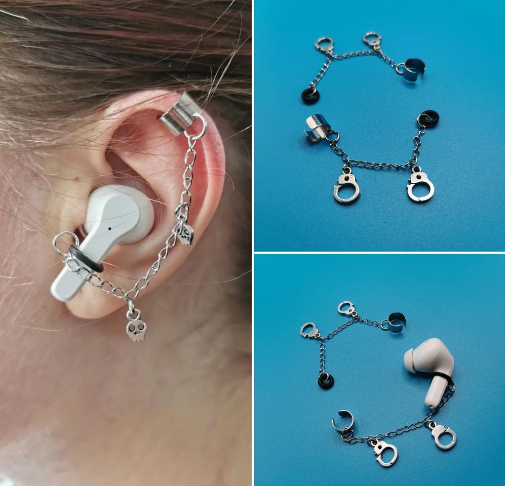 Ear cuff chain accessory holding wireless earbud and ear.