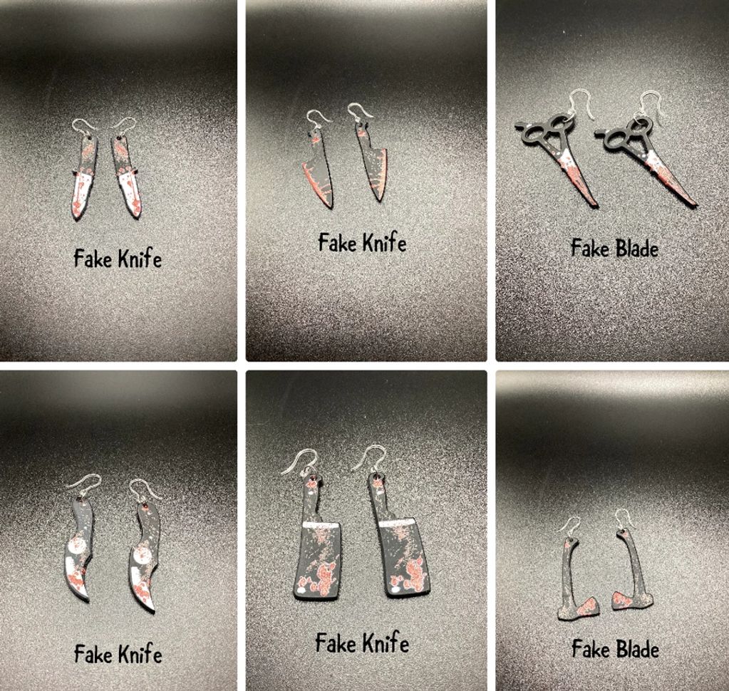 Earrings shaped like fake knives and blades.