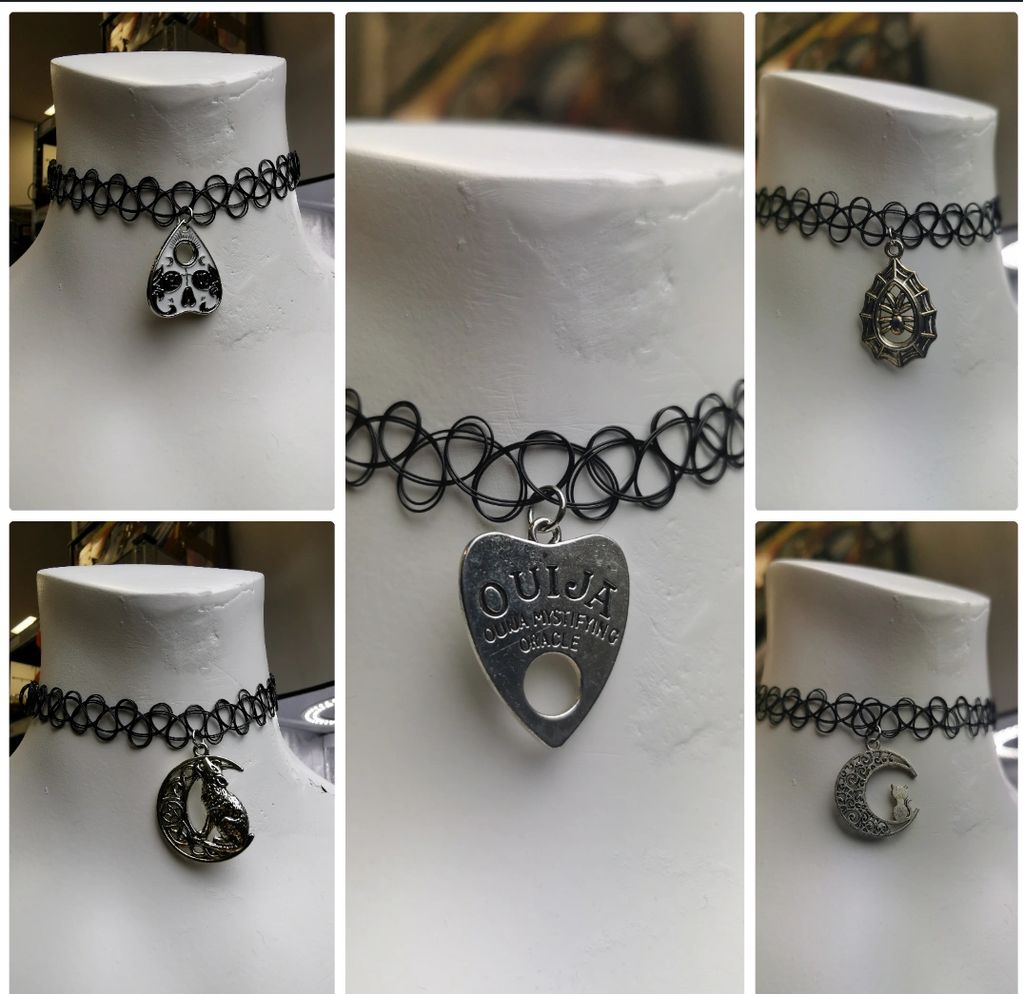 Five black choker necklaces with unique silver pendants.