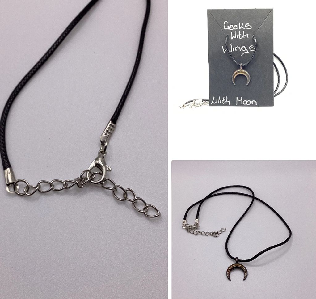 Black cord necklace with crescent moon pendant.