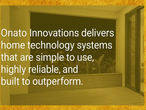 Modern indoor-outdoor home with a sleek patio and sliding glass doors.