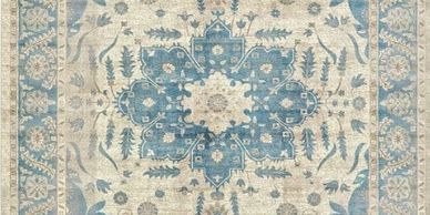 Decorative area rug with blue motif offered by The Design Gallery and our vendor Jaunty Area Rugs