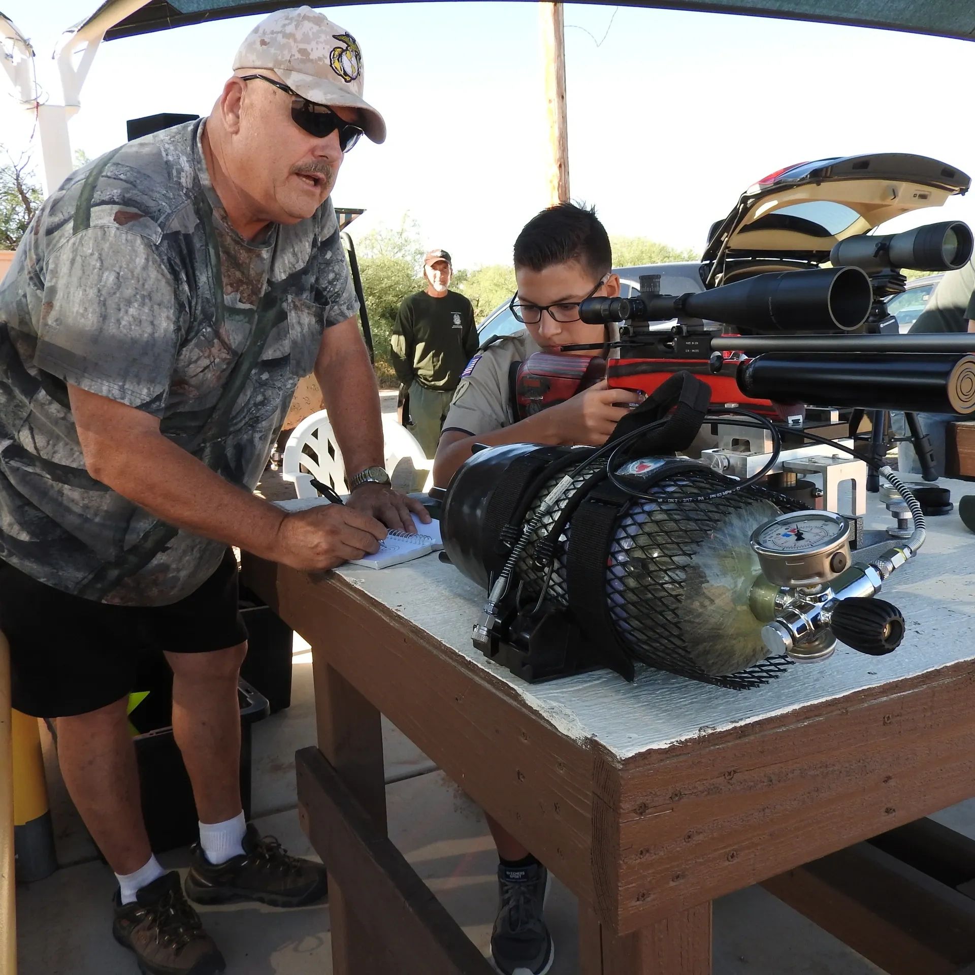 Head Coaching Instructor Patrick Shely with an up and coming marksman.