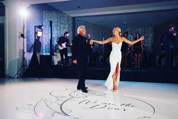 Father/daughter dance on a custom floor.
