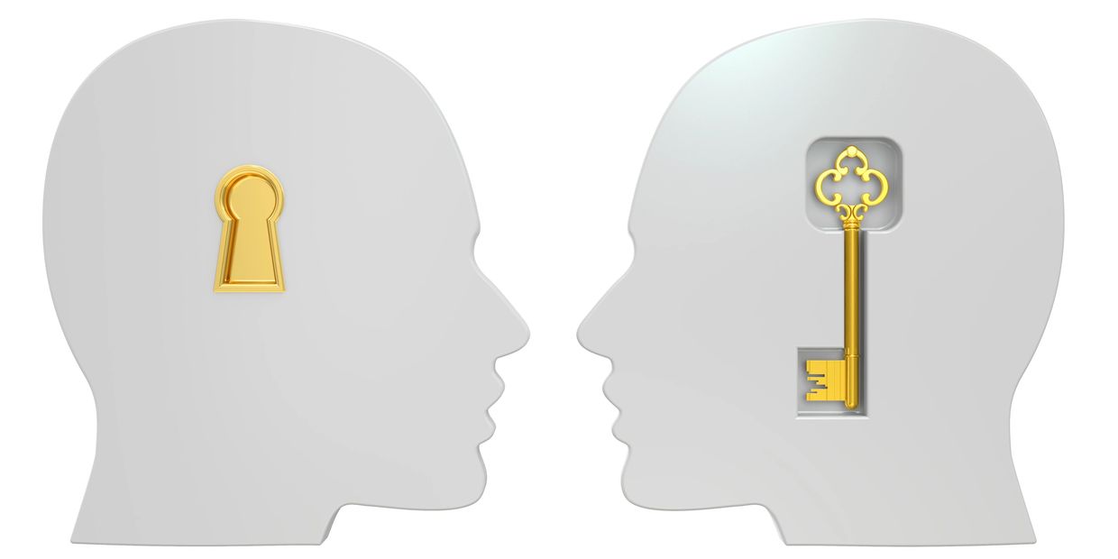 a head with a key and a head with a keyhole