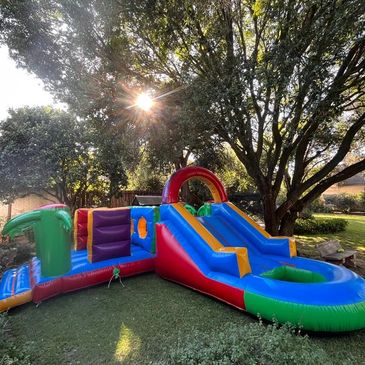 adventure island, obstacle course, jumping castle with slide and pond