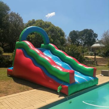 wave water slide, pool slide, green and blue