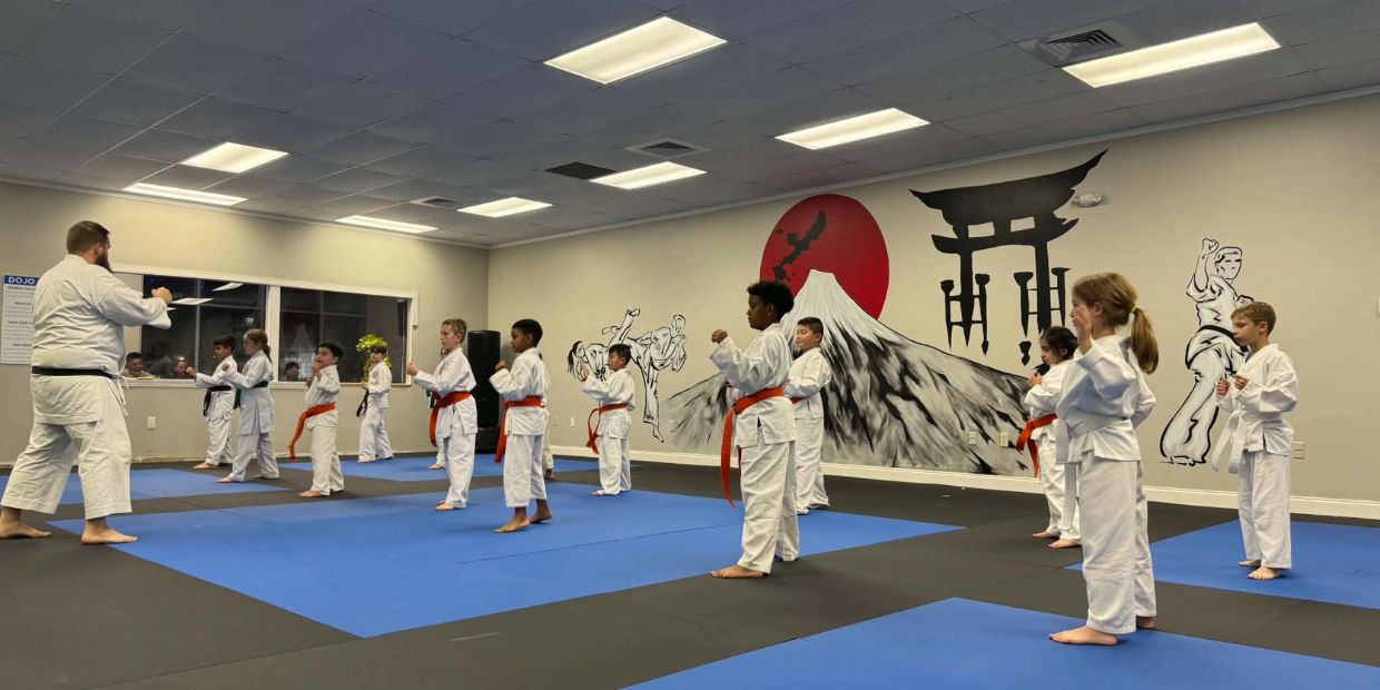 Children practicing traditional Okinawan karate during a kids karate class at West Coast Karate in Lutz, Florida.