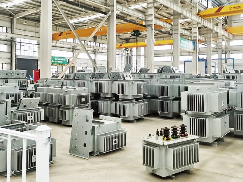 Industrial warehouse filled with electrical transformers.