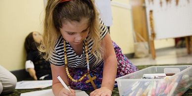 Child making poster for prisoners in Avery Mitchell. Kairos Prison Ministry in Spruce Pine, NC
