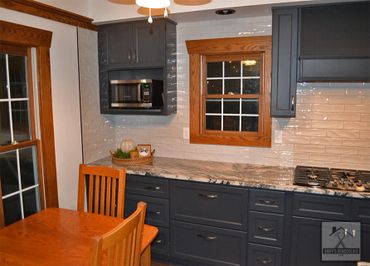 Full kitchen remodel with custom counters, cabinets, and backsplash