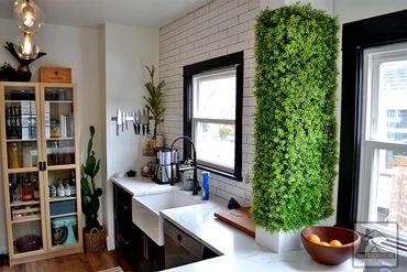 Kitchen Remodel - black cabinets and subway tile backsplash by Smiff’s Remodeling in Lakewood, Ohio