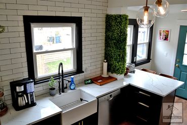 Kitchen Remodel black cabinets & white backsplash installed by Smiff’s Remodeling in Lakewood Ohio