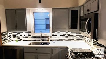 Custom backsplash, countertops, and cabinets