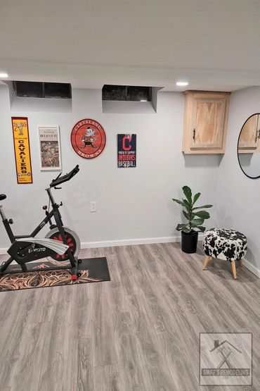 Basement remodel in Rocky river, Ohio - new walls, lights and floor installed by Smiff’s Remodeling