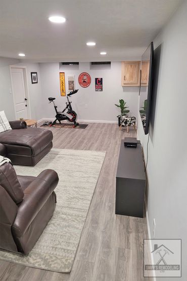 Basement remodel in Rocky river, Ohio - new walls, lights and floor installed by Smiff’s Remodeling