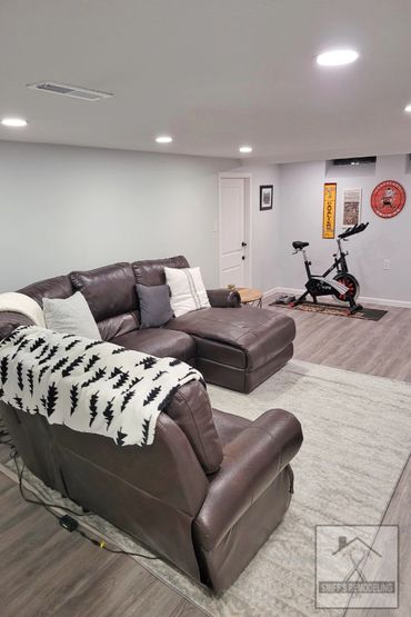Basement remodel in Rocky river, Ohio - new walls, lights and floor installed by Smiff’s Remodeling