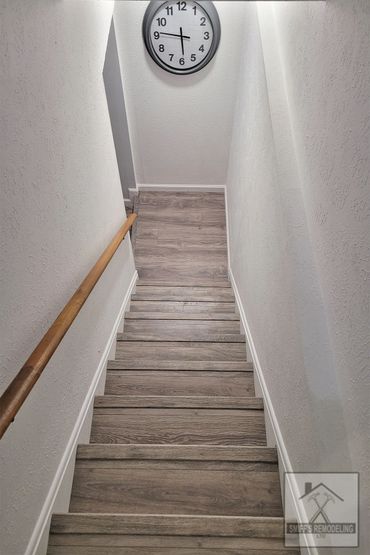 Basement remodel in Rocky river, Ohio - new luxury vinyl floor installed by Smiff’s Remodeling