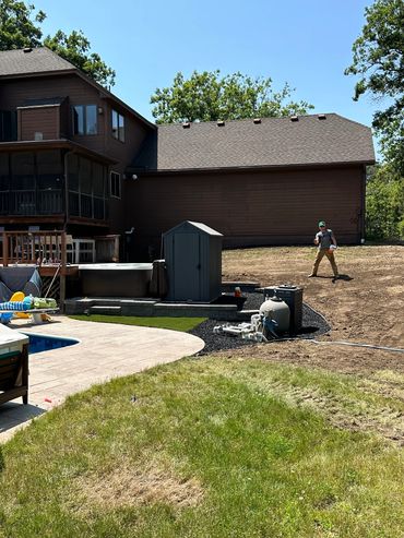 Hot tub pad installed with turf and Versa-Lok retaining wall block