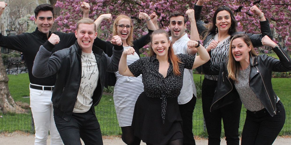 Team photo of Vern Musical improv, flexing their arms, in signature pose in Madison Square Park