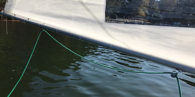 A sagging mainsheet on the boom of Sunfish can lead to tangled lines and capsizing.