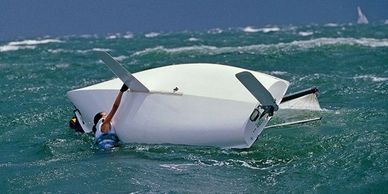 A capsized sailboat can turn turtle without a mast bob.