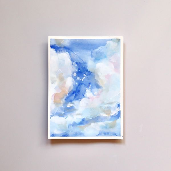 Watercolour and gouache atmospheric cloud painting in blues, white, pink and yellow by Renée Anne