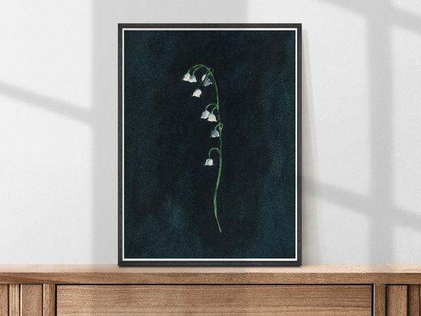 Lily of the Valley watercolour painting on a black background shown framed as a print by Renee Anne