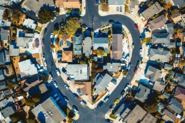 Aerial view of a heart-shaped residential street with houses.