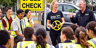Instructor teaches young drivers during a safety check event.