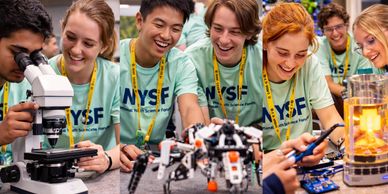Excited students in NYSF t-shirts explore science and robotics together.