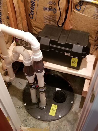 Sump pump system installed in closet