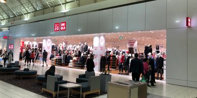Photo of UNIQLO storefront at the Coquitlam Centre. Aluminum composite panel design