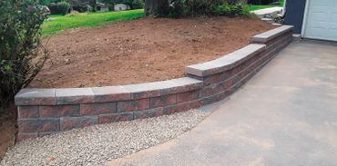 Retaining wall defines and holds its own