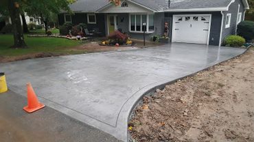 Gray colored concrete driveway