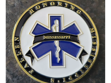 A commemorative coin honoring Mississippi EMS fallen members.