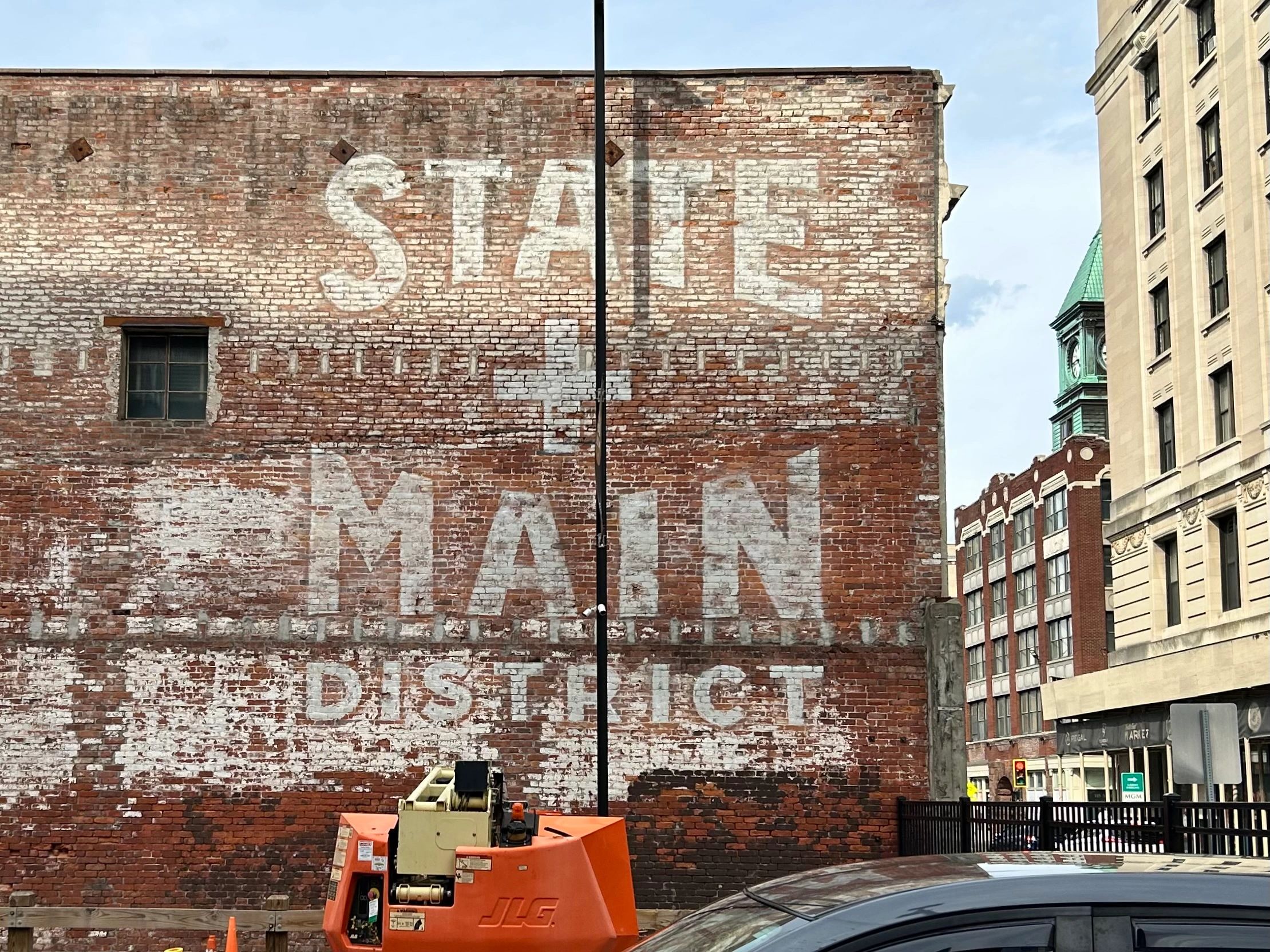 Ghost letters painted on wall in Springfield, MA that says State + Main District
18ft X 19ft