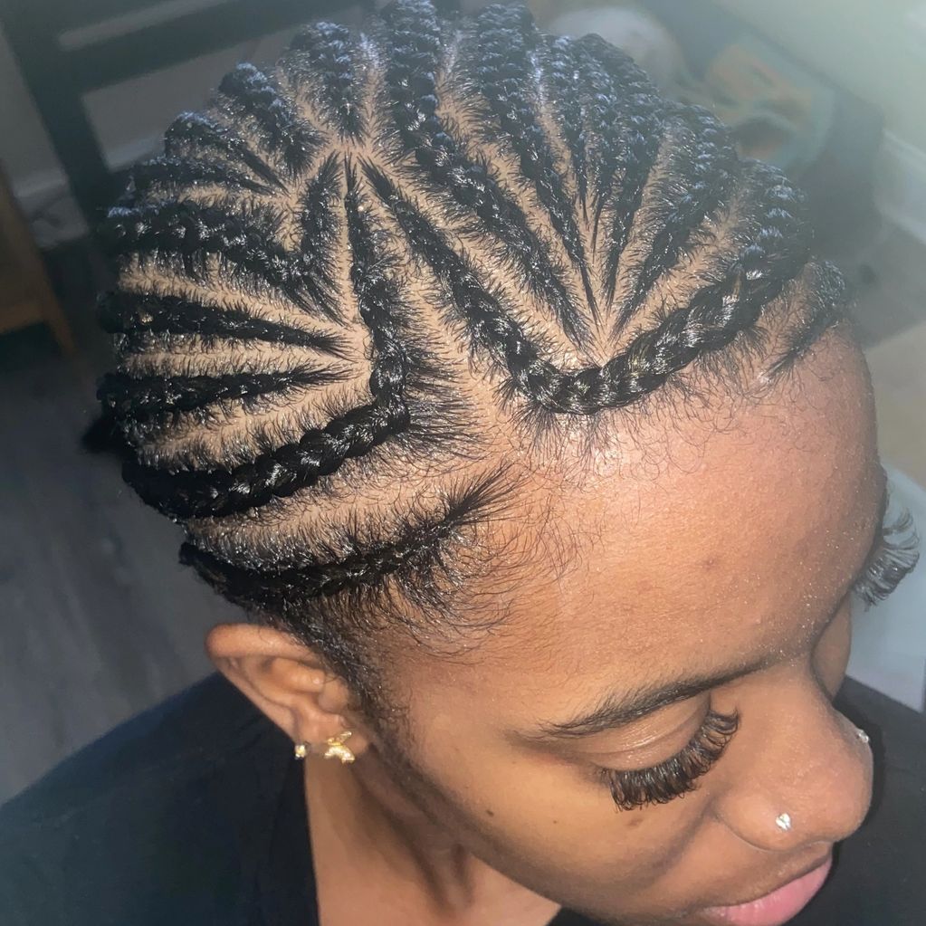 Cornrows/tribal braids with added hair.