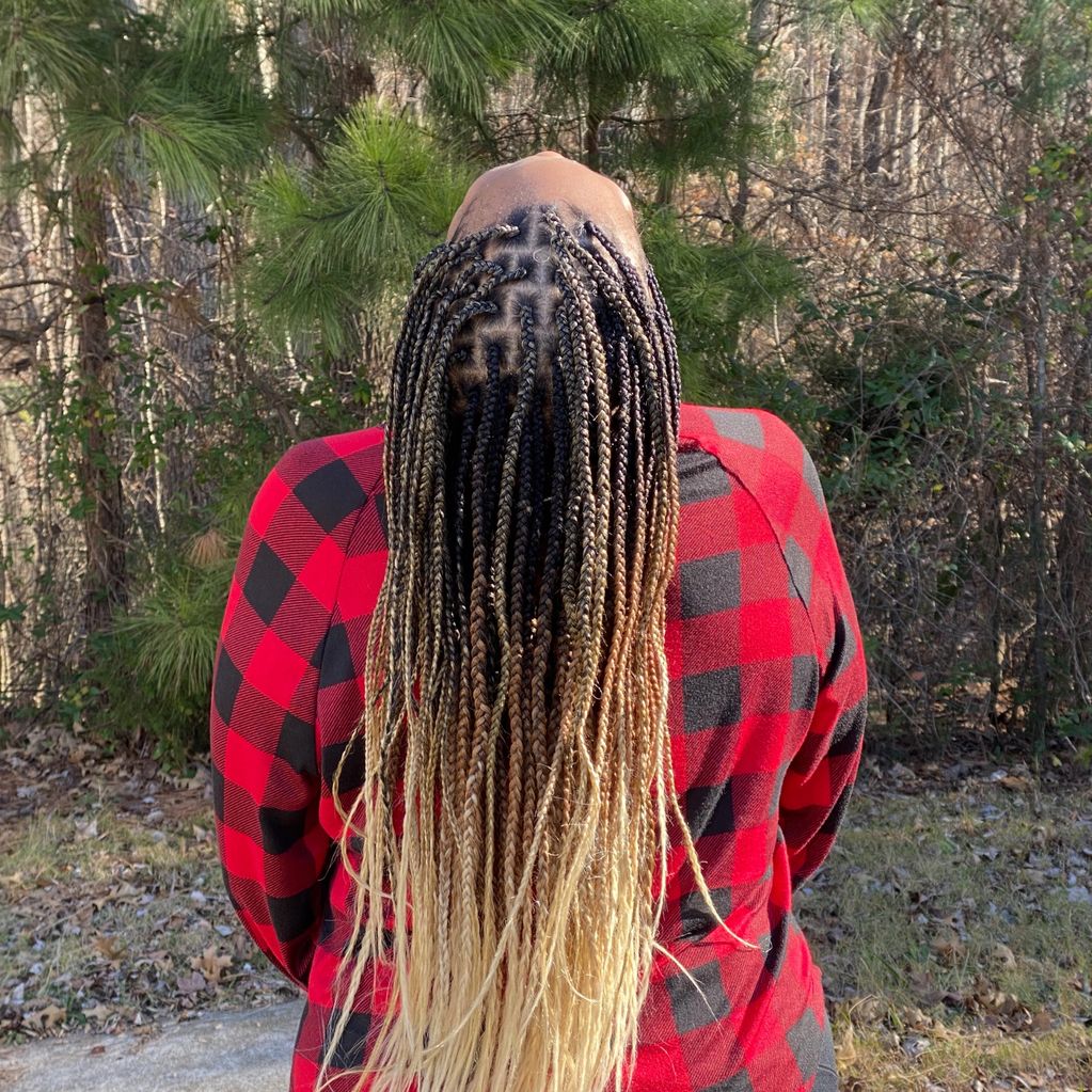 Medium/small box braids with added hair.