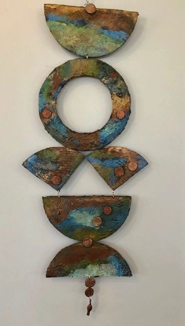 two dimensional abstract artwork. Resembles Raku pottery. Two dimensional.