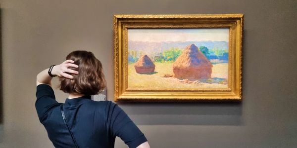 Monet's Hay Stakcs Series in Orsay With POMART wandering in front.
