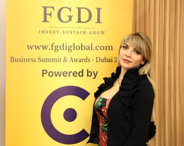 Woman posing at FGDI Business Summit in Dubai.