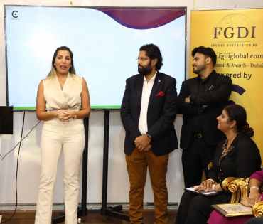 Woman speaking to group at a business event.