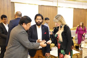 People interacting in a formal setting.